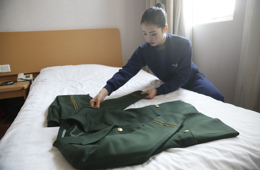 Retired female soldier trains hard to be flight attendant