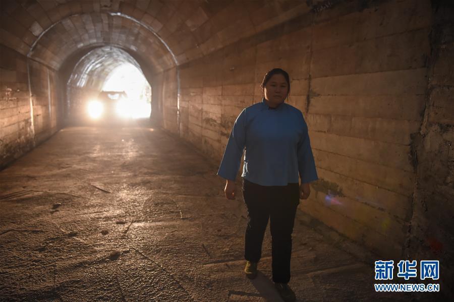 Female villager digs tunnel linking isolated village to outside world