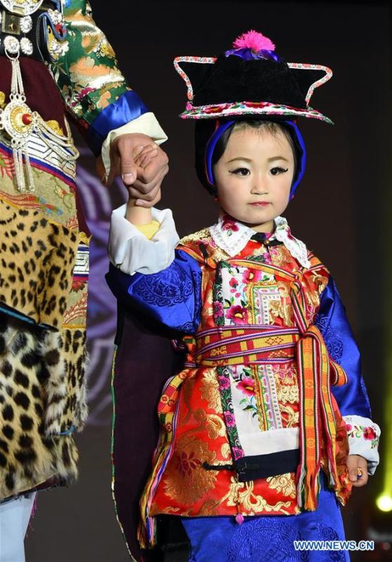 Models present costumes of ethnic groups in Yunnan