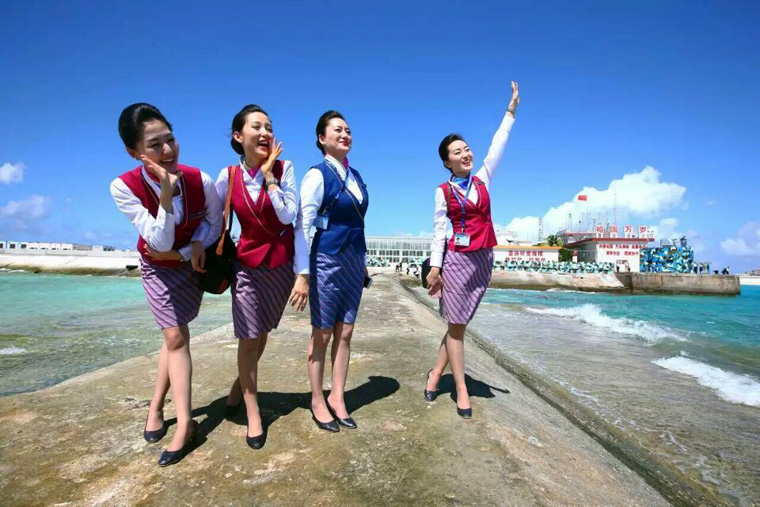 Chinese stewardess celebrate test flight at Nansha Islands airfield