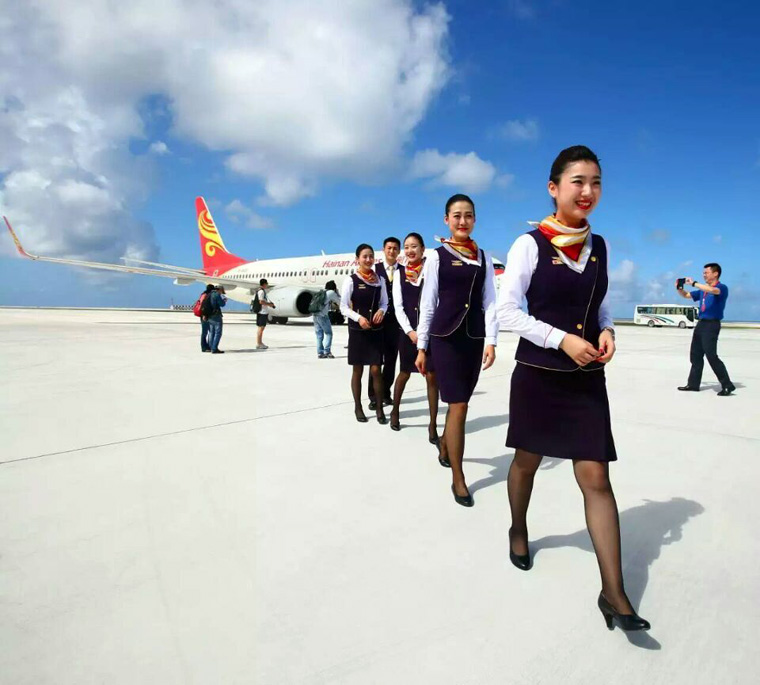 Chinese stewardess celebrate test flight at Nansha Islands airfield