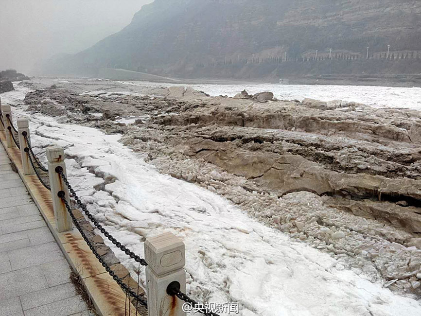 Breathtaking frozen Hukou Waterfall
