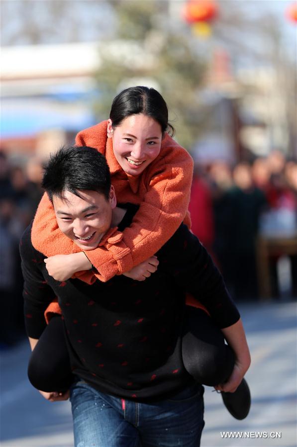 Wife-carrying contest held during celebrations in C China