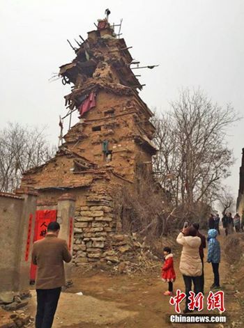 Man spends 10 years building a 7-story house out of clay, stone and wood