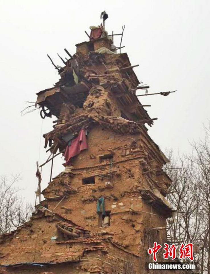 Man spends 10 years building a 7-story house out of clay, stone and wood