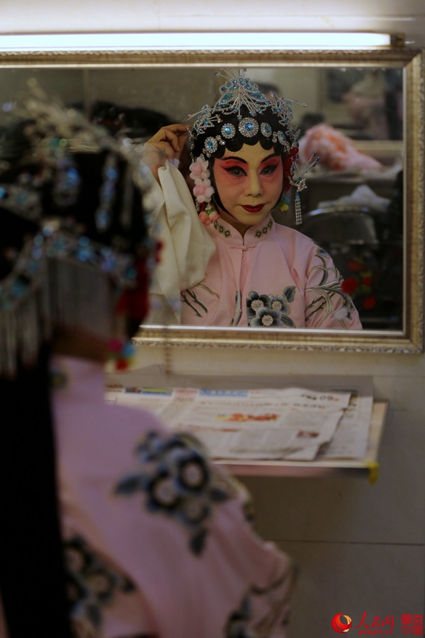 The backstage of a traditional Chinese opera troupe