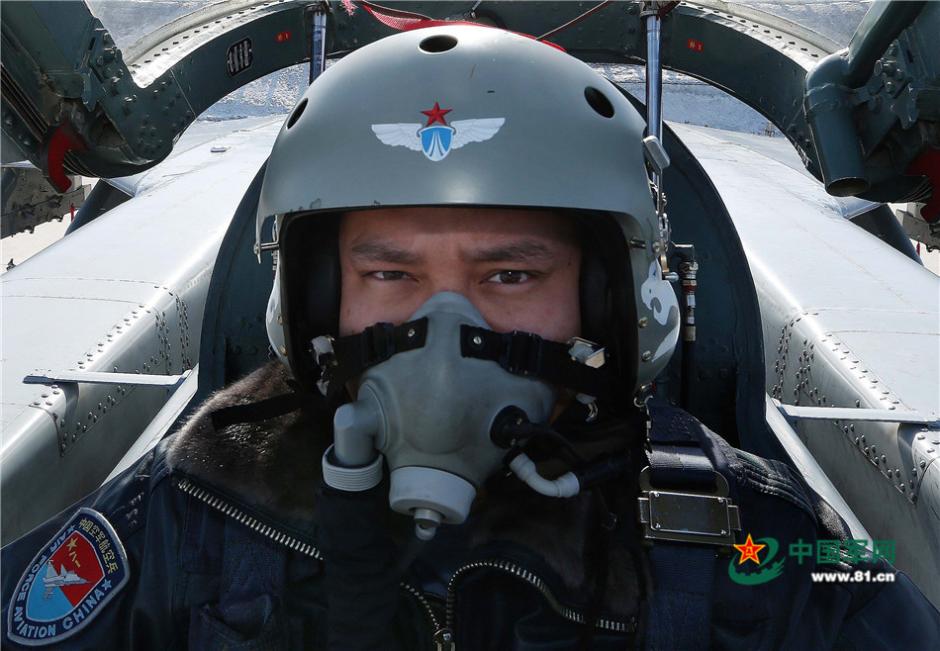 Uygur pilots of PLA Air Force fly over snow-capped mountains