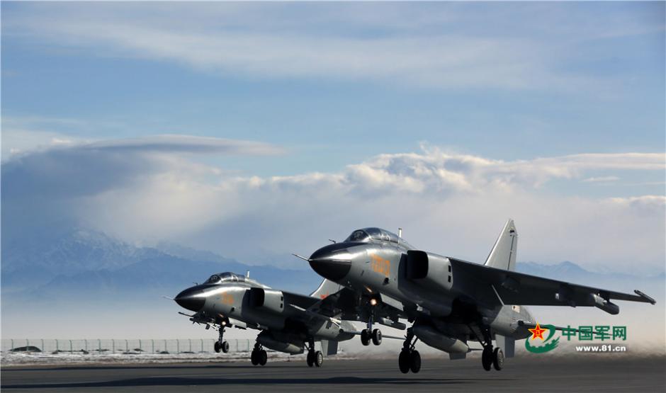 Uygur pilots of PLA Air Force fly over snow-capped mountains