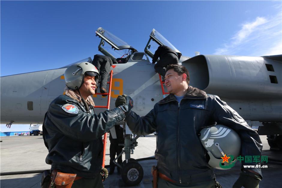 Uygur pilots of PLA Air Force fly over snow-capped mountains