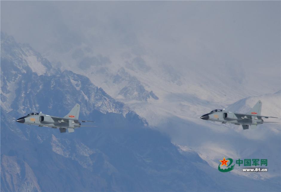 Uygur pilots of PLA Air Force fly over snow-capped mountains