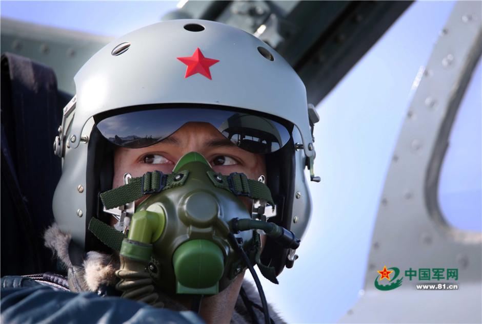 Uygur pilots of PLA Air Force fly over snow-capped mountains