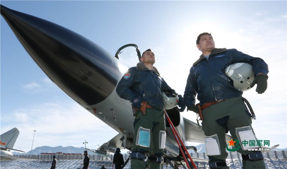 Uygur pilots of PLA Air Force fly over snow-capped mountains