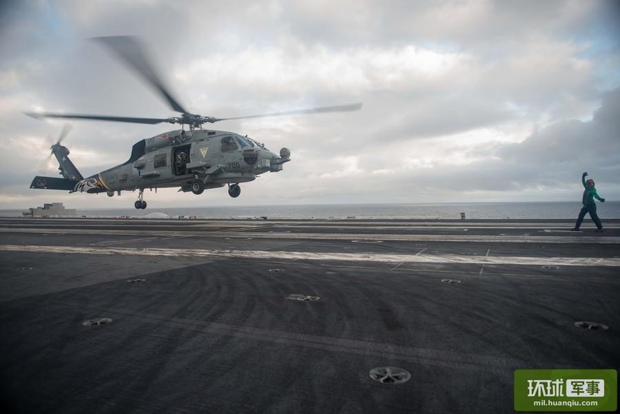 Chinese ships keep close watch on U.S. Navy aircraft carrier strike group in S. China Sea 