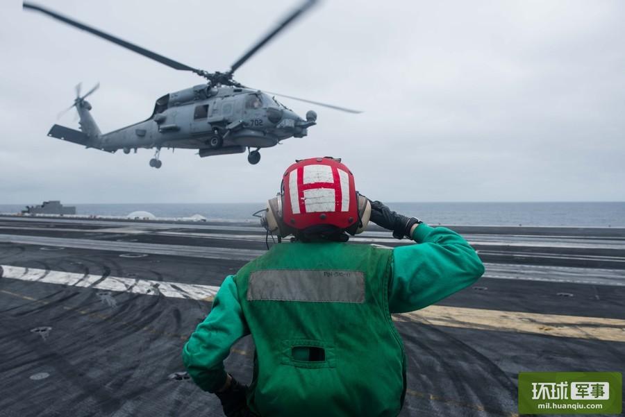 Chinese ships keep close watch on U.S. Navy aircraft carrier strike group in S. China Sea 