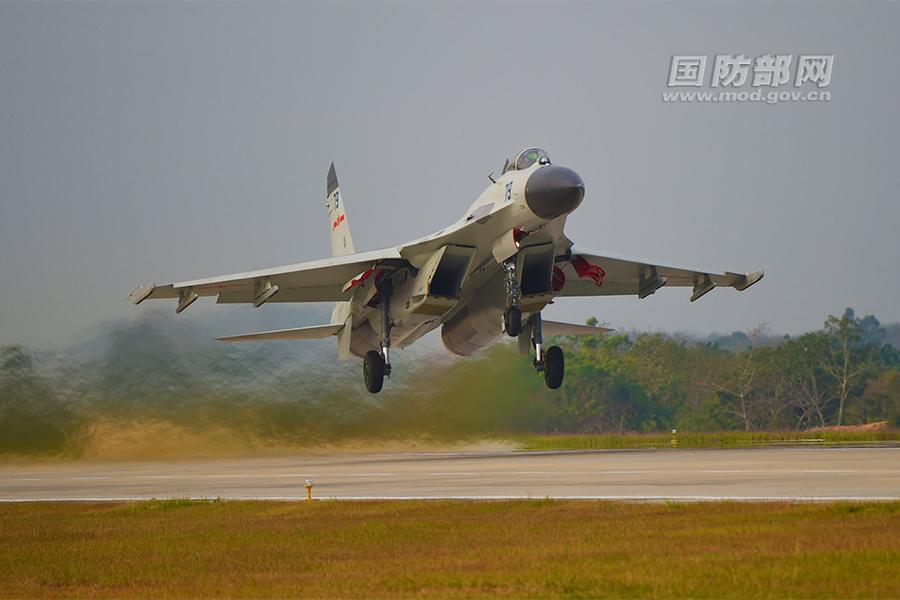 Chinese J-11 fighters conduct training in South China Sea