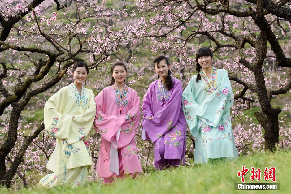 College girls in ancient costume promote peach blossom festival