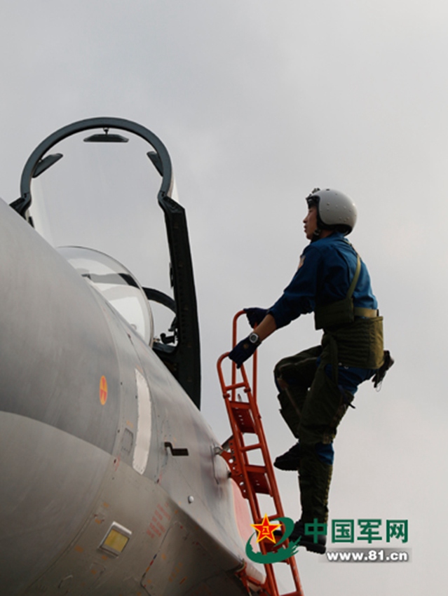 J-11 fighter jets conduct air-to-air combat training