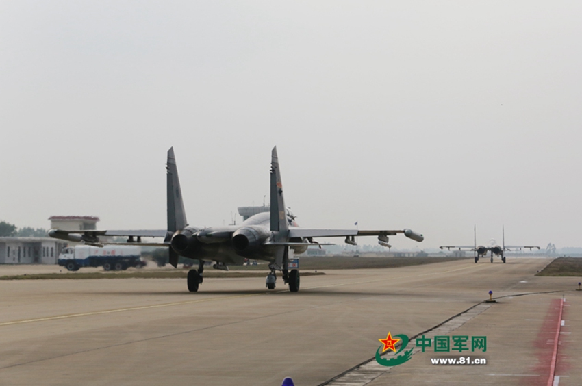 J-11 fighter jets conduct air-to-air combat training