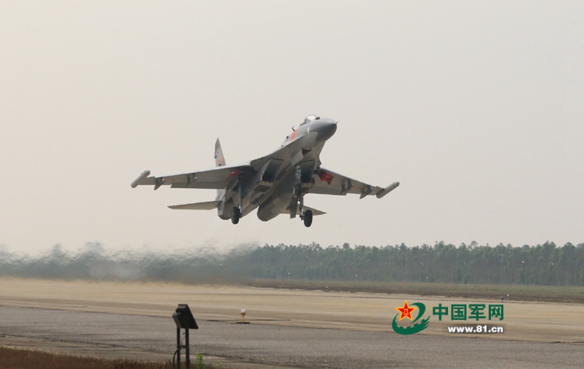 J-11 fighter jets conduct air-to-air combat training