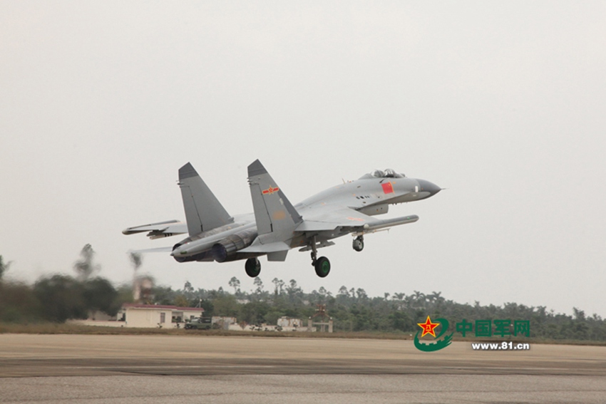 J-11 fighter jets conduct air-to-air combat training