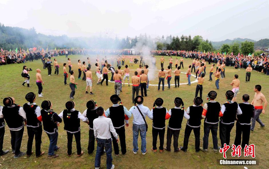 Half-naked men scramble for fireworks in Guangxi