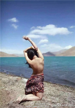 Chinese woman poses nude at sacred Tibetan lake
