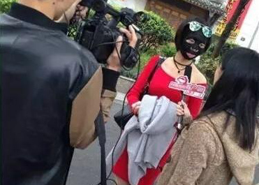 Woman rides subway wearing facial mask