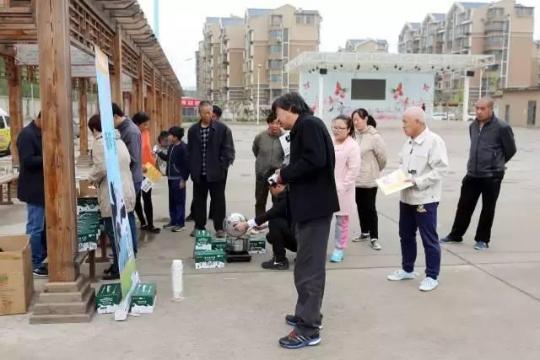 Woman milks a cow in a Beijing neighborhood 