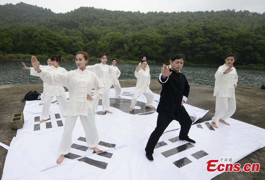 Tai Chi master leads lake performance 