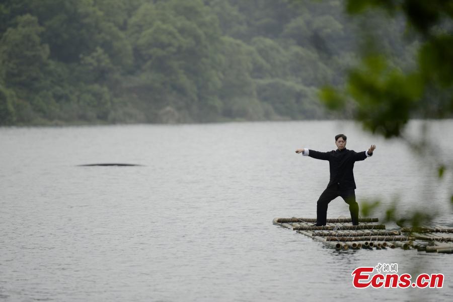 Tai Chi master leads lake performance 