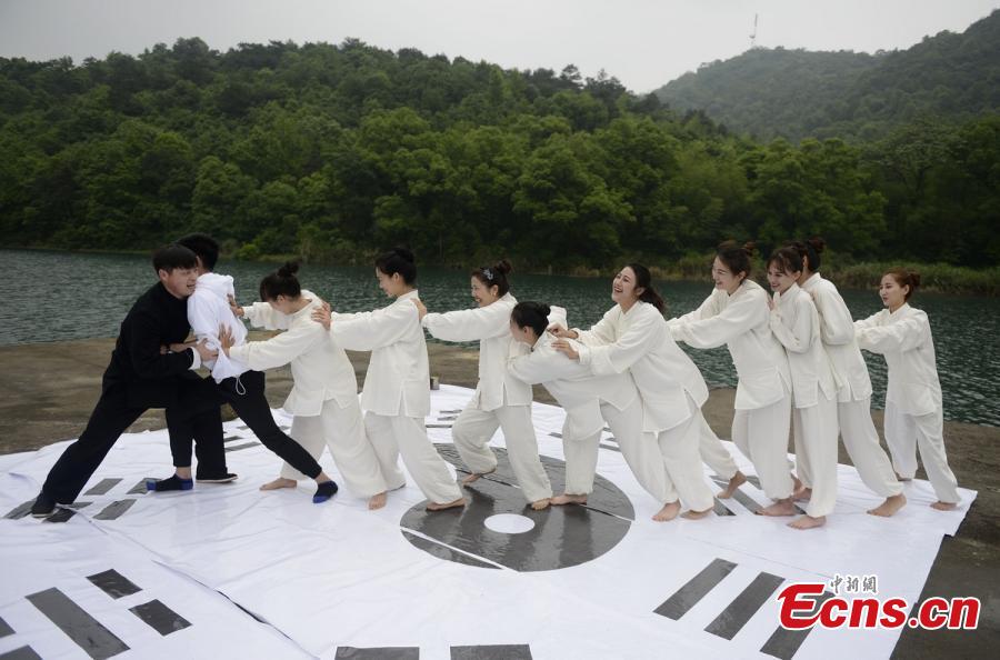 Tai Chi master leads lake performance 