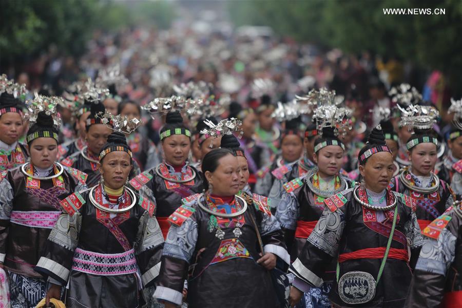 Traditional costumes of Miao ethnic group displayed on parade show in SW China