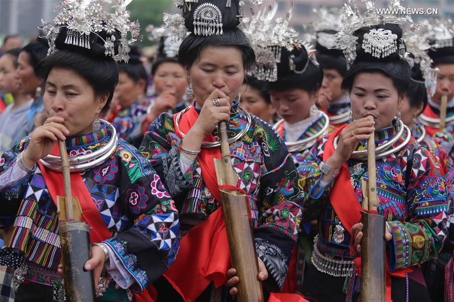 Traditional costumes of Miao ethnic group displayed on parade show in SW China