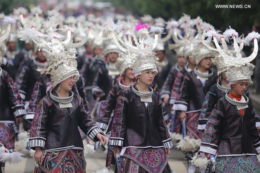 Traditional costumes of Miao ethnic group displayed on parade show in SW China