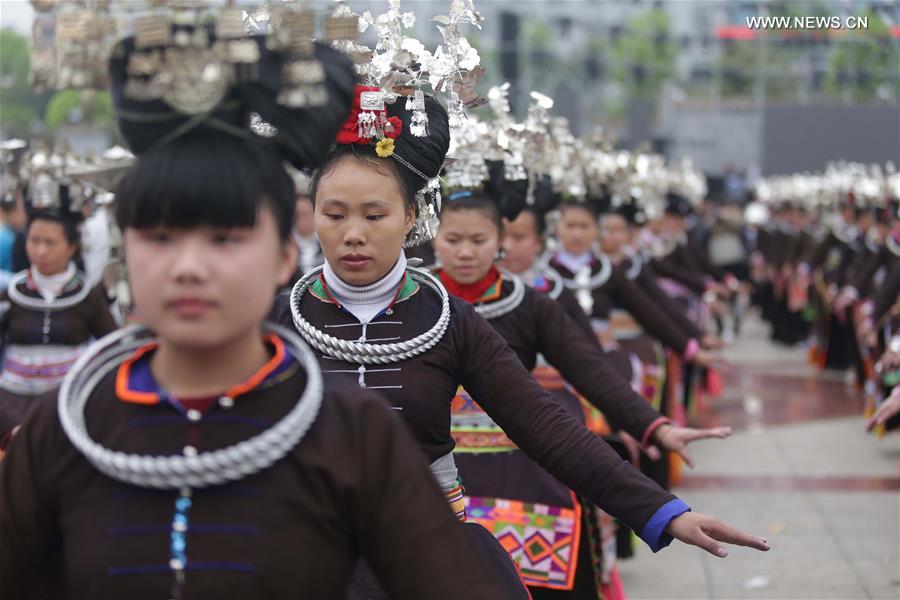 Traditional costumes of Miao ethnic group displayed on parade show in SW China