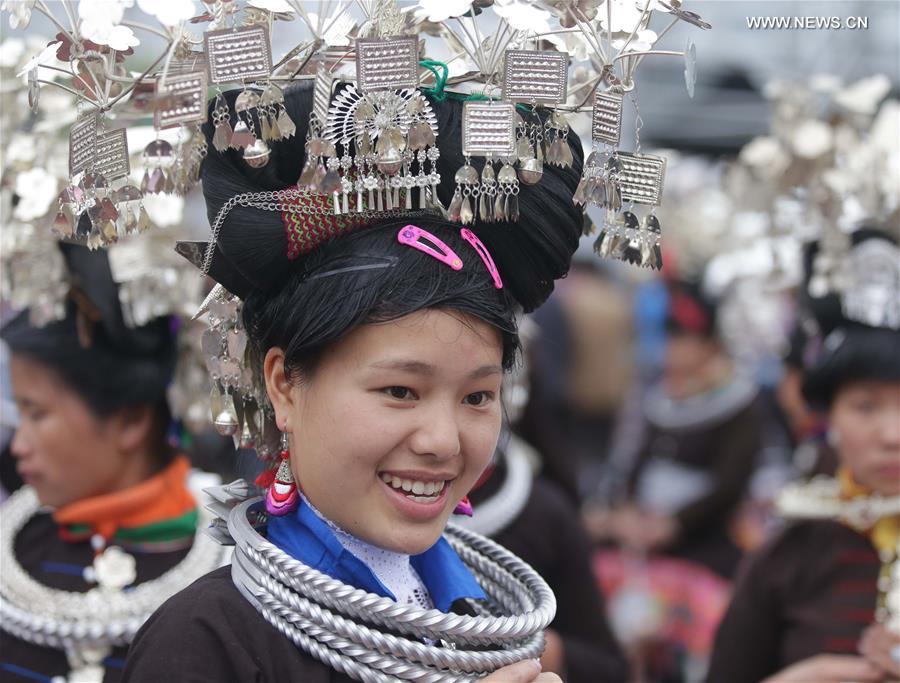 Traditional costumes of Miao ethnic group displayed on parade show in SW China