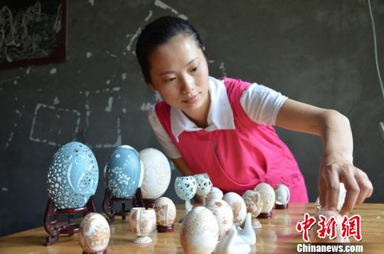 ‘World on an eggshell’: disabled girl develops passion for egg carving