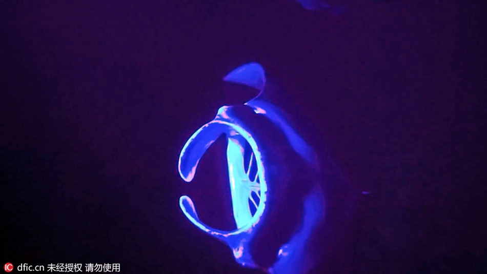 Aliens from outer space? Manta rays in purple light