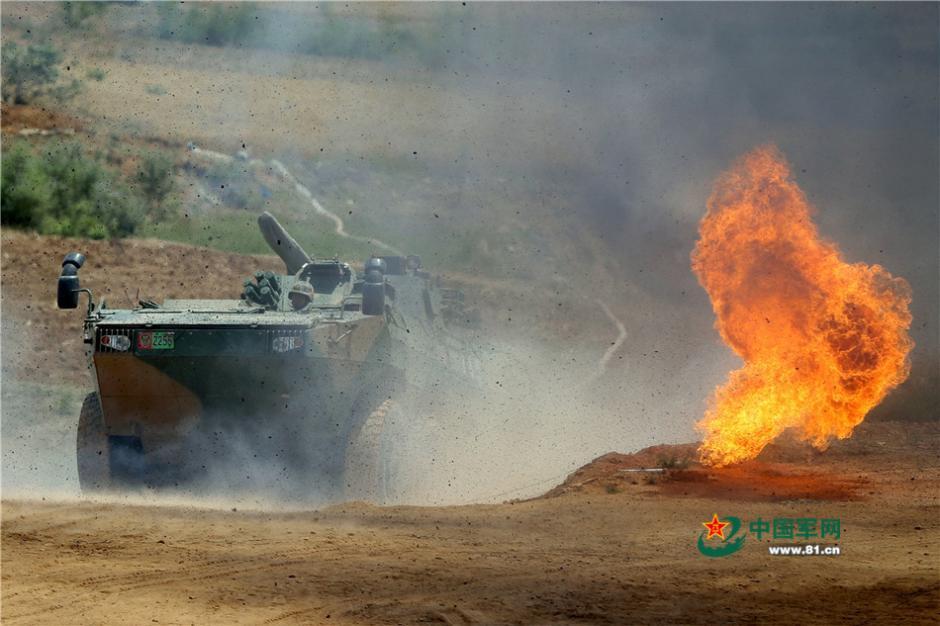 Soldiers driving eight-wheeled infantry fighting vehicles in combat training