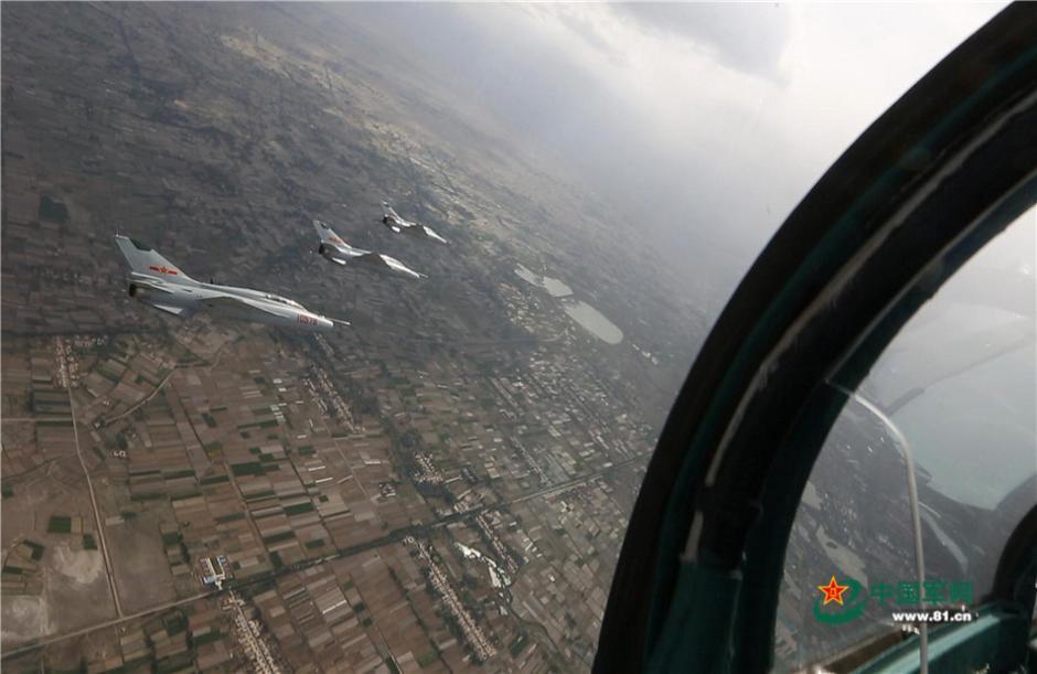 Fighters conduct drill over the Qilian Mountains