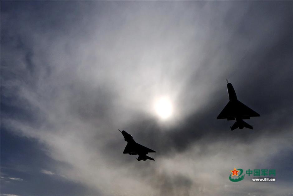 Fighters conduct drill over the Qilian Mountains