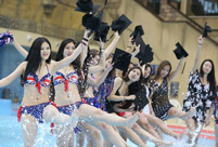 Students take stylish bikini graduations photos
