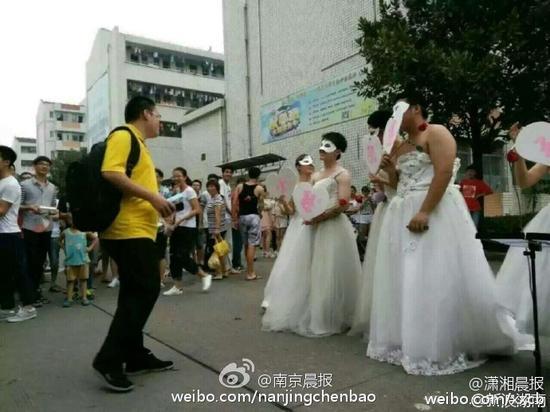 Female college teacher proposes to student in wedding dress