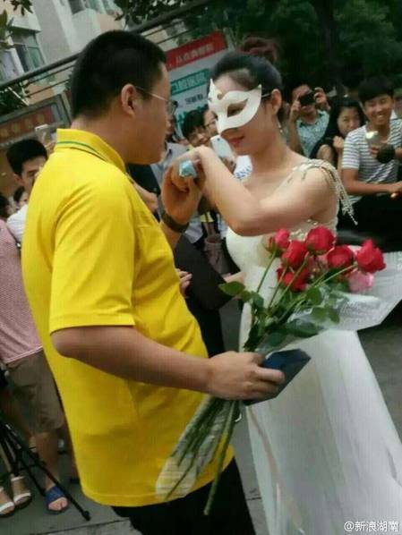 Female college teacher proposes to student in wedding dress