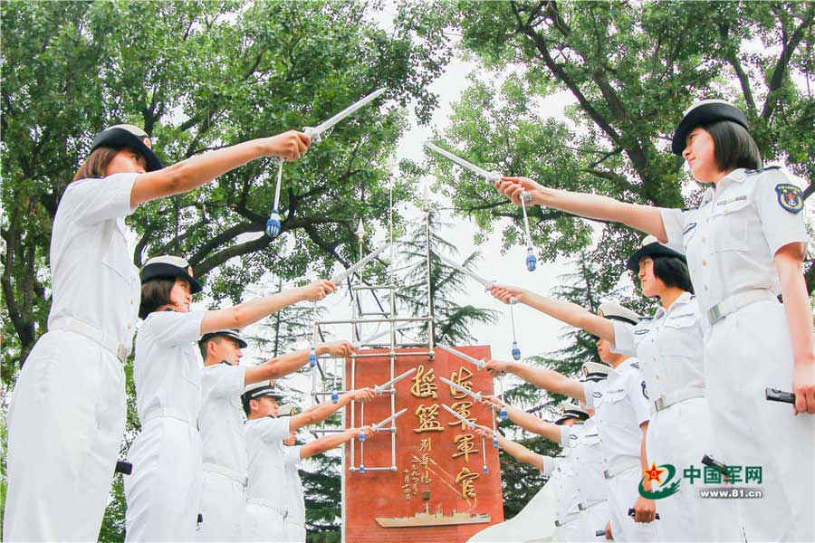 Swords conferred upon naval academy graduates