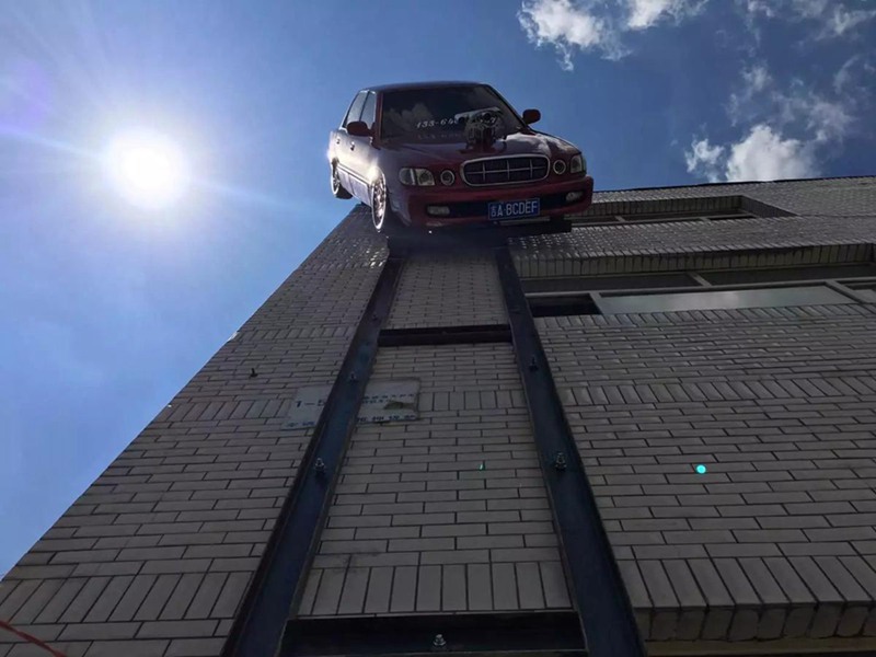 Man suspends car on outer wall of building