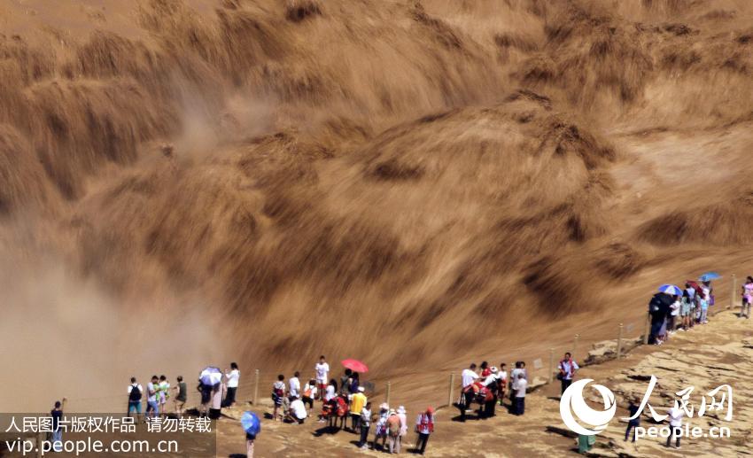 Spectacular Hukou Waterfall during summer flood season