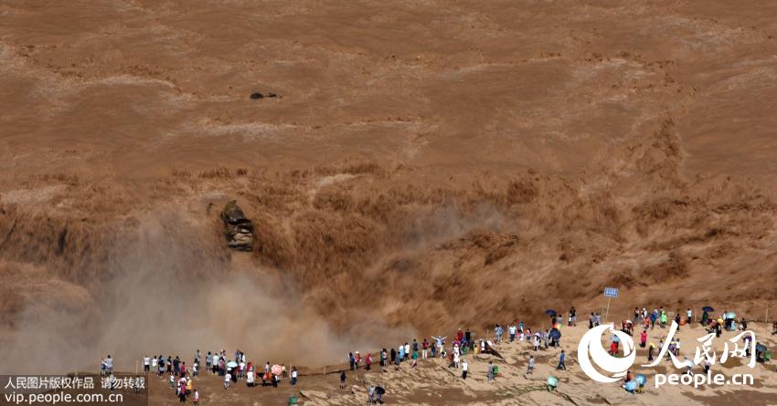 Spectacular Hukou Waterfall during summer flood season