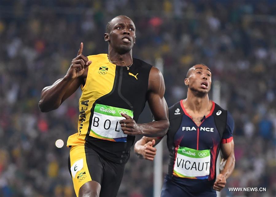 Bolt wins third Olympic men's 100m title