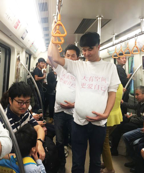 'Pregnant' men in Chengdu subway call for more freedom for pregnant women